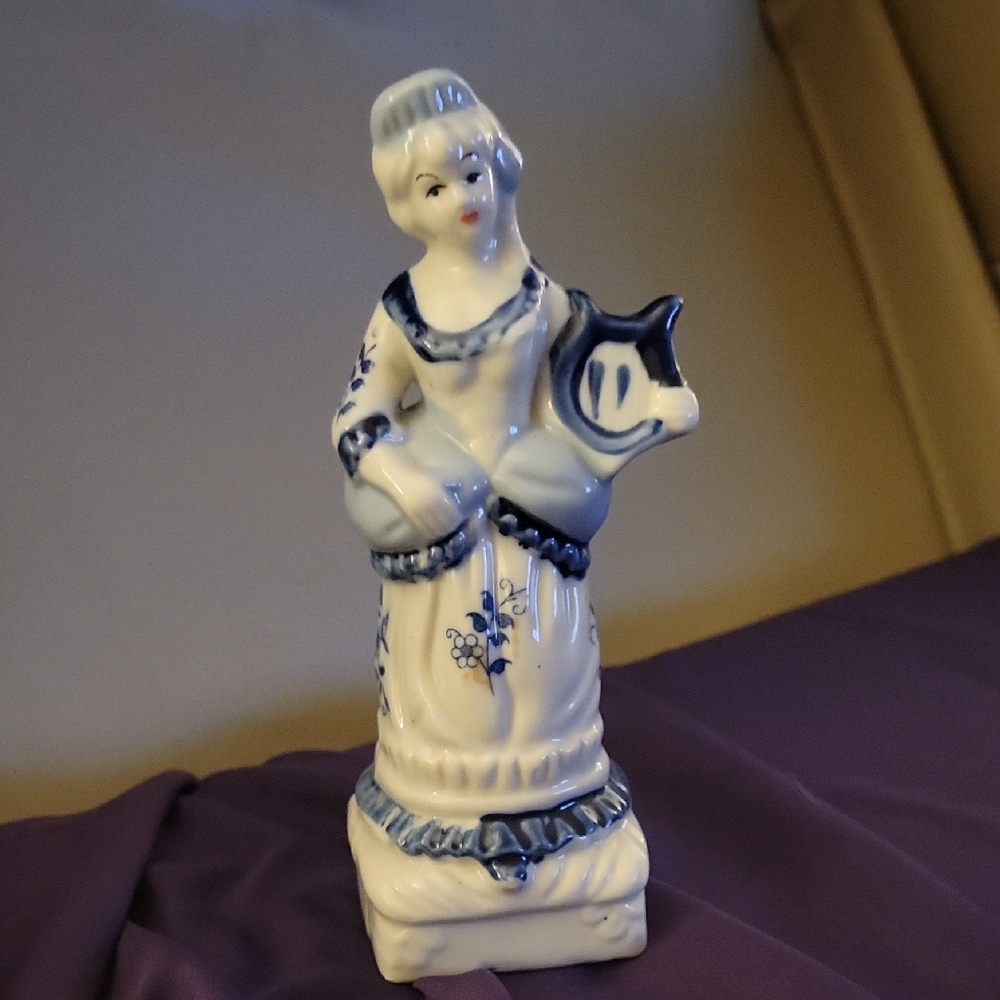 Vintage Porcelain Figurine with Blue Accents